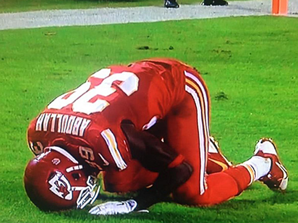 Husain Abdullah prostrates himself in the end zone in prayer to Allah after scoring a touchdown.